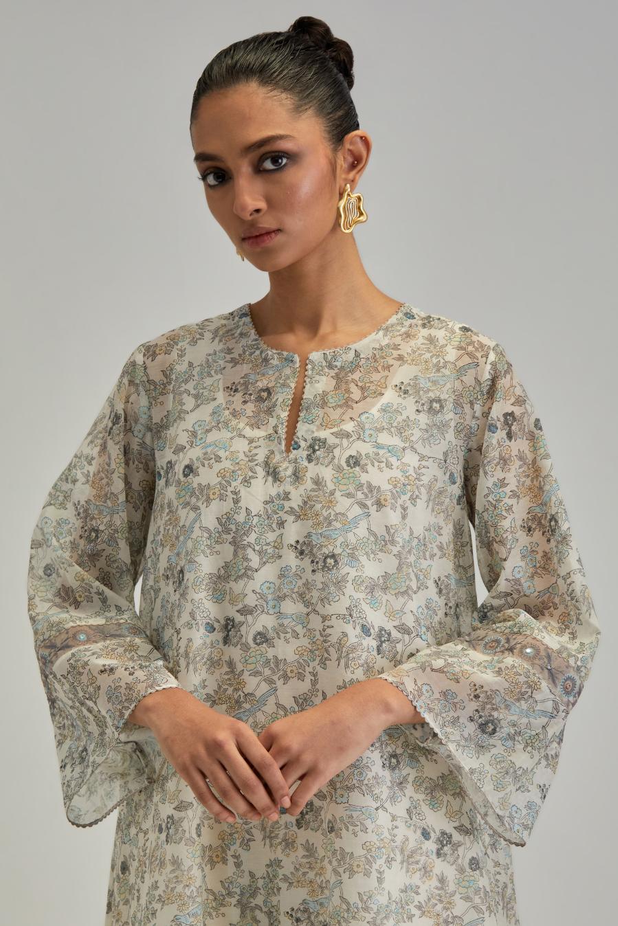 Silk Chanderi short A-line kurta set with all-over earthy coloured hand block print and embroidery at kurta hem and sleeves.