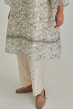 Silk Chanderi short A-line kurta set with all-over earthy coloured hand block print and embroidery at kurta hem and sleeves.