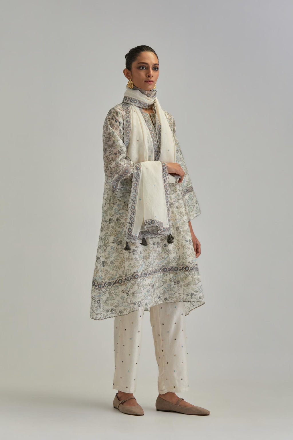 Silk Chanderi short A-line kurta set with all-over earthy coloured hand block print and embroidery at kurta hem and sleeves.