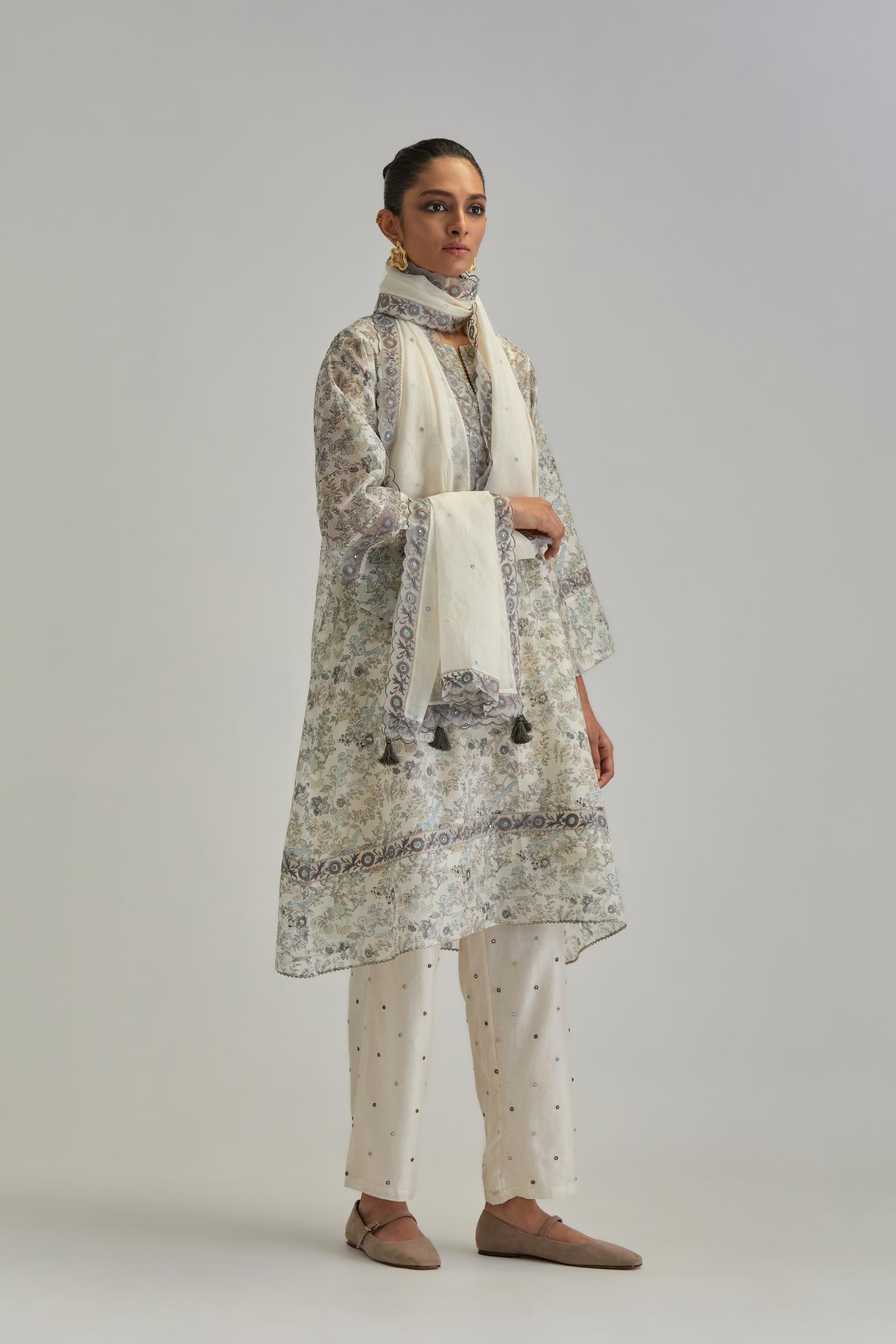 Silk Chanderi short A-line kurta set with all-over earthy coloured hand block print and embroidery at kurta hem and sleeves.