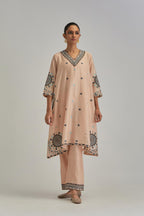 Pink silk Chanderi short V-neck kurta set, with straight hem and side pockets, decorated with fine appliqué and Aari thread embroidery.