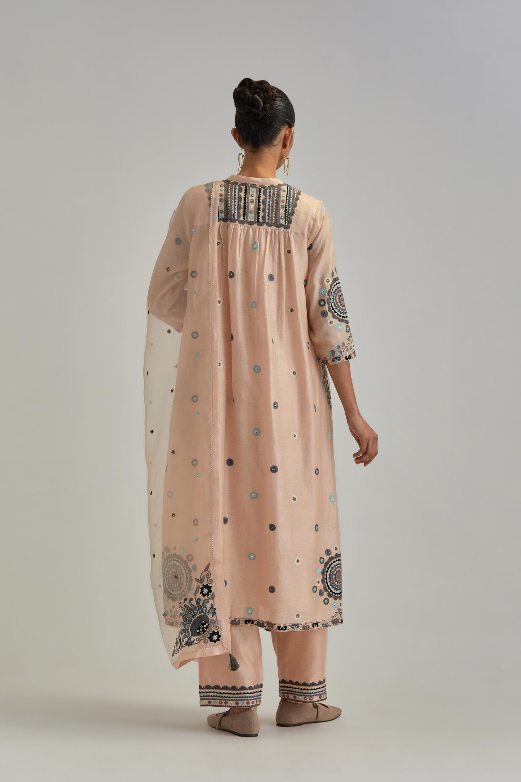 Pink silk Chanderi gathered kurta-dress set with appliqué stripes along with aari thread work flowers and floral trellises along with a circular appliqued motif.