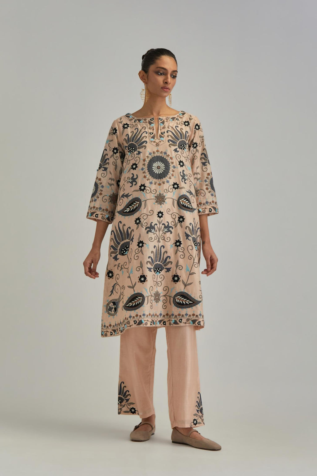 Pink short A-line silk Chanderi kurta set, fully embroidered with earthy coloured appliqué with Aari thread work and silk tassels.