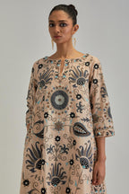 Pink short A-line silk Chanderi kurta set, fully embroidered with earthy coloured appliqué with Aari thread work and silk tassels.