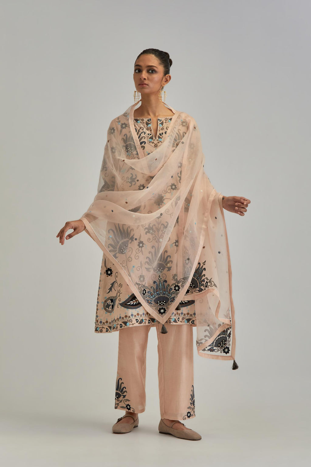 Pink short A-line silk Chanderi kurta set, fully embroidered with earthy coloured appliqué with Aari thread work and silk tassels.