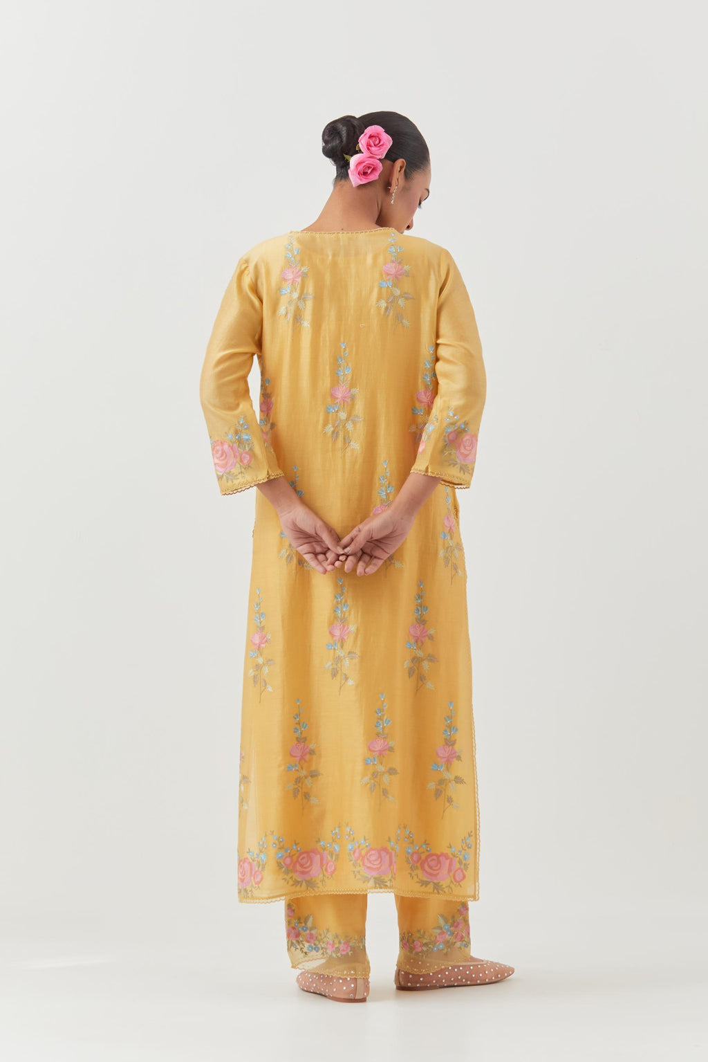 Yellow silk Chanderi straight kurta set with all-over rose embroidery and scalloped organza detail at the edges.