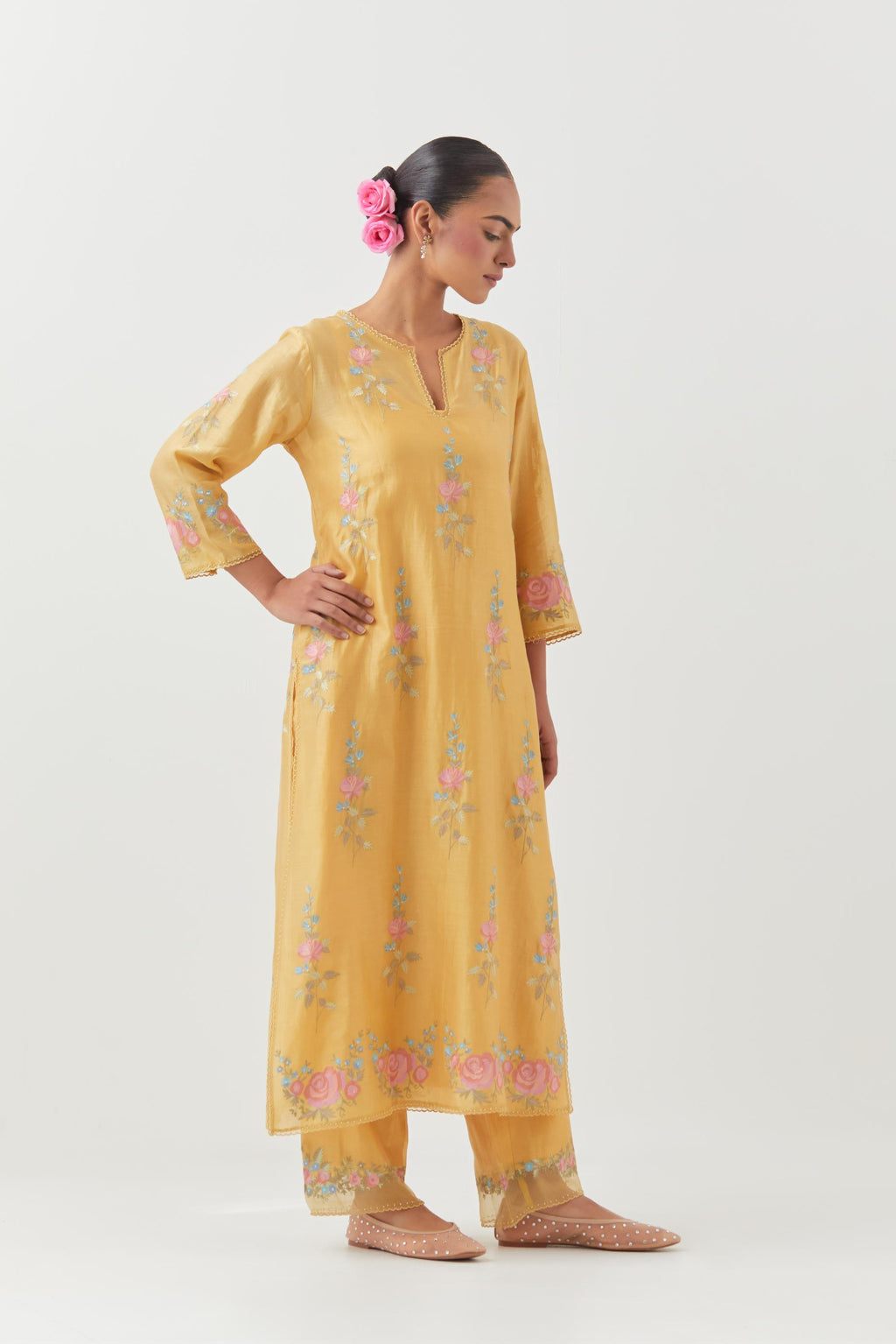 Yellow silk Chanderi straight kurta set with all-over rose embroidery and scalloped organza detail at the edges.