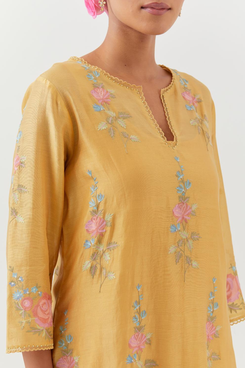 Yellow silk Chanderi straight kurta set with all-over rose embroidery and scalloped organza detail at the edges.