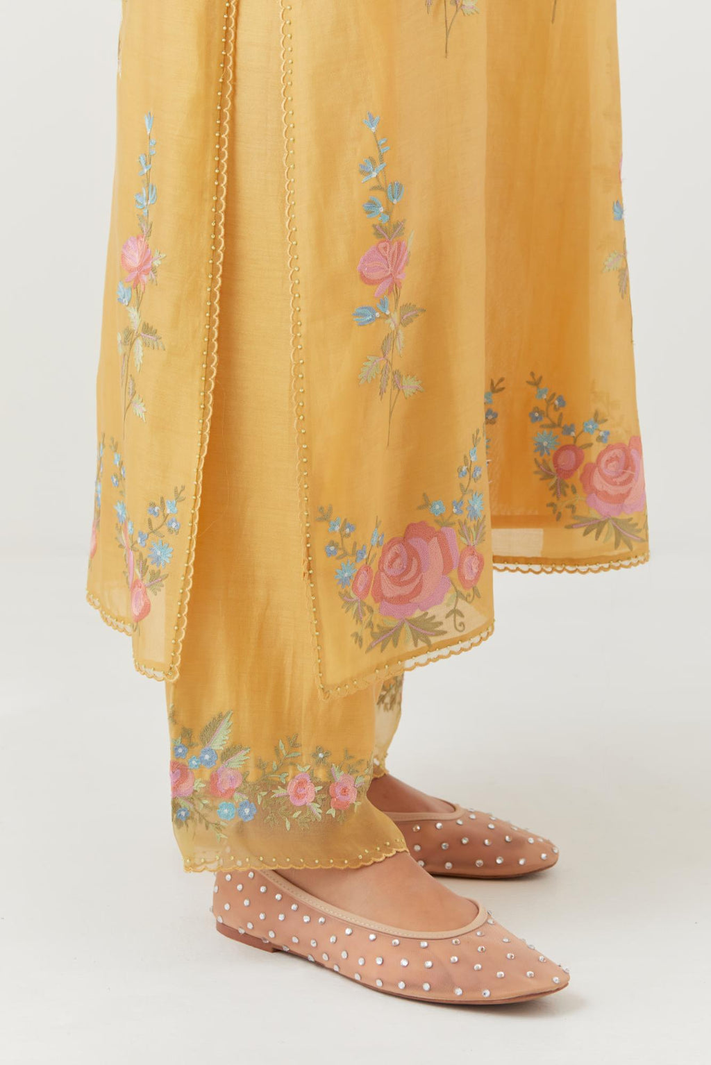 Yellow silk Chanderi straight kurta set with all-over rose embroidery and scalloped organza detail at the edges.