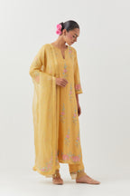 Yellow silk organza dupatta with a narrow silk border finished with a delicate organza scalloped edge, highlighted with contrast bead work.