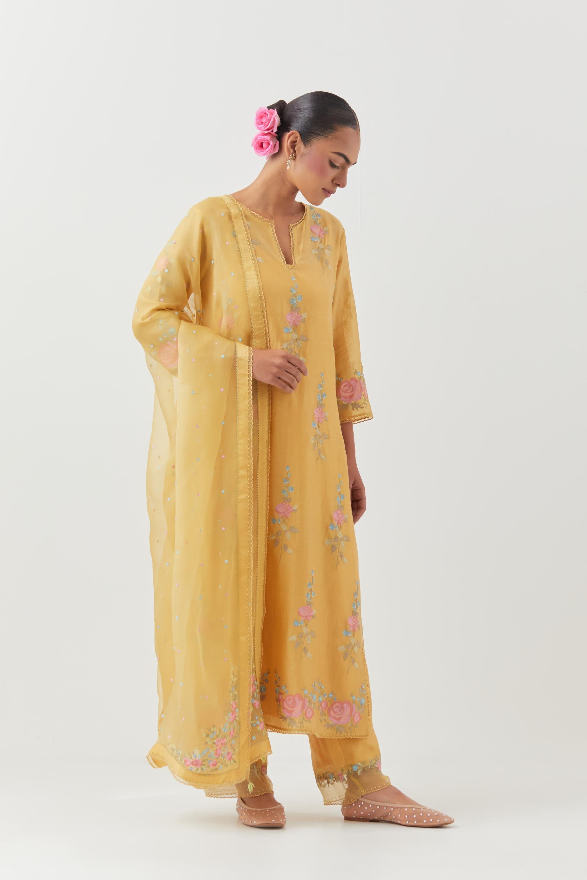 Yellow silk Chanderi straight kurta set with all-over rose embroidery and scalloped organza detail at the edges.