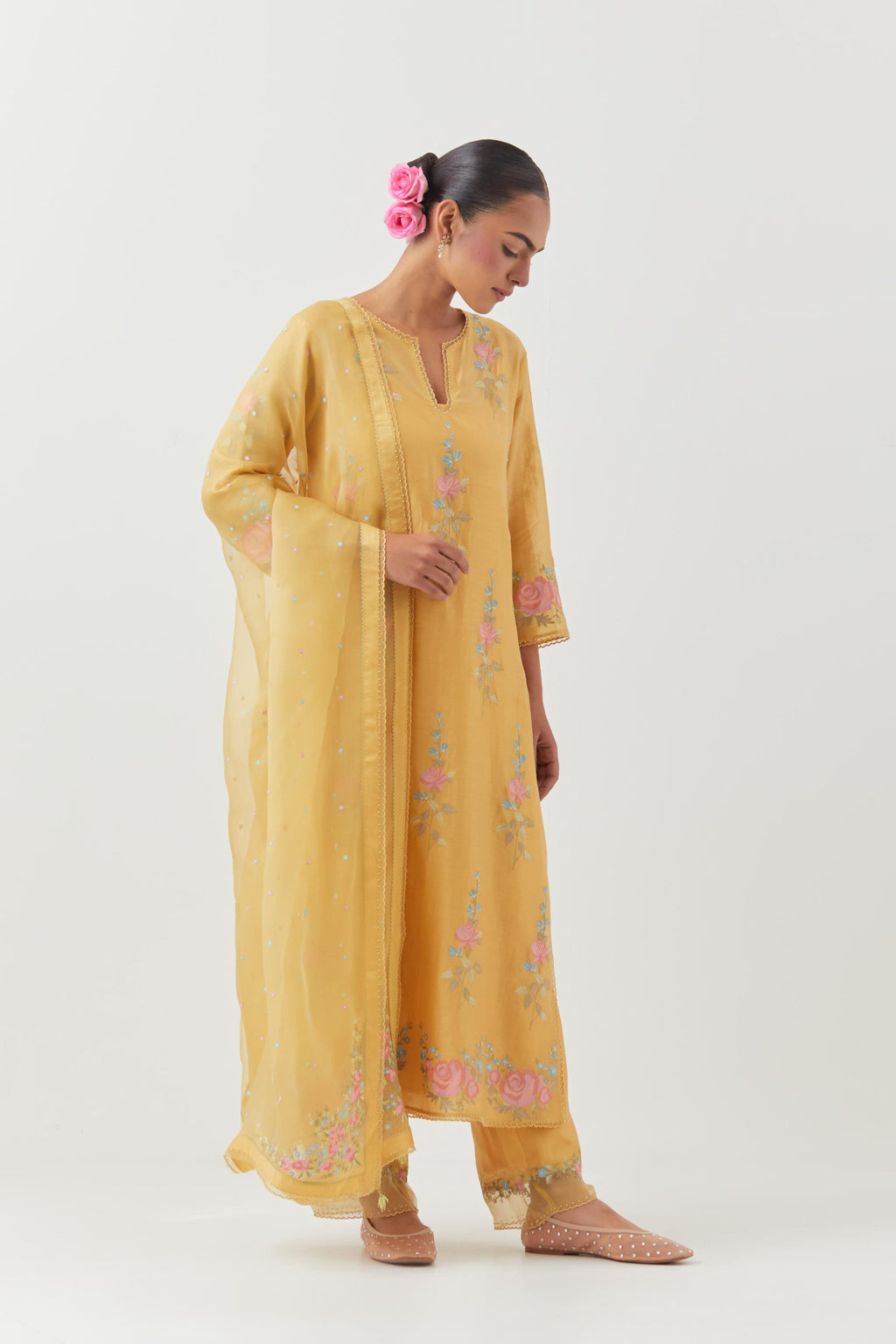 Yellow silk Chanderi straight kurta set with all-over rose embroidery and scalloped organza detail at the edges.