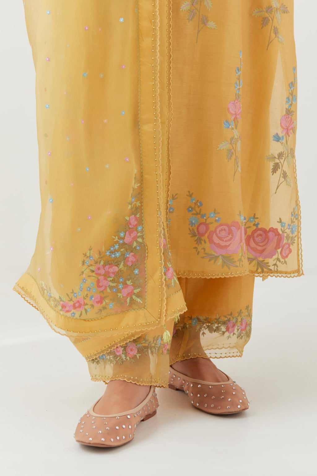 Yellow silk organza dupatta with a narrow silk border finished with a delicate organza scalloped edge, highlighted with contrast bead work.