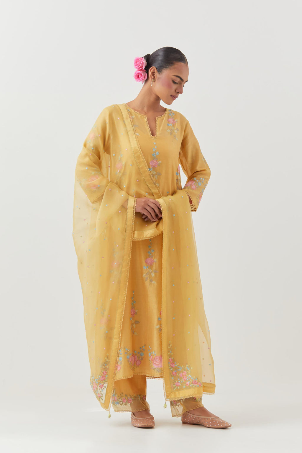 Yellow silk Chanderi straight kurta set with all-over rose embroidery and scalloped organza detail at the edges.