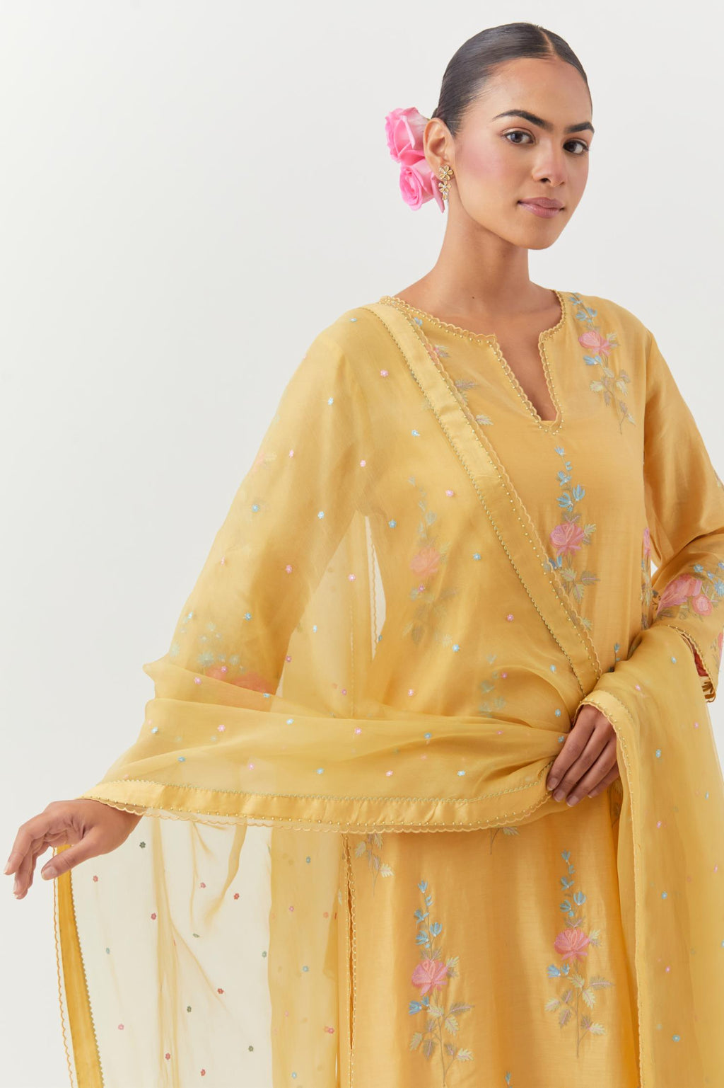 Yellow silk organza dupatta with a narrow silk border finished with a delicate organza scalloped edge, highlighted with contrast bead work.