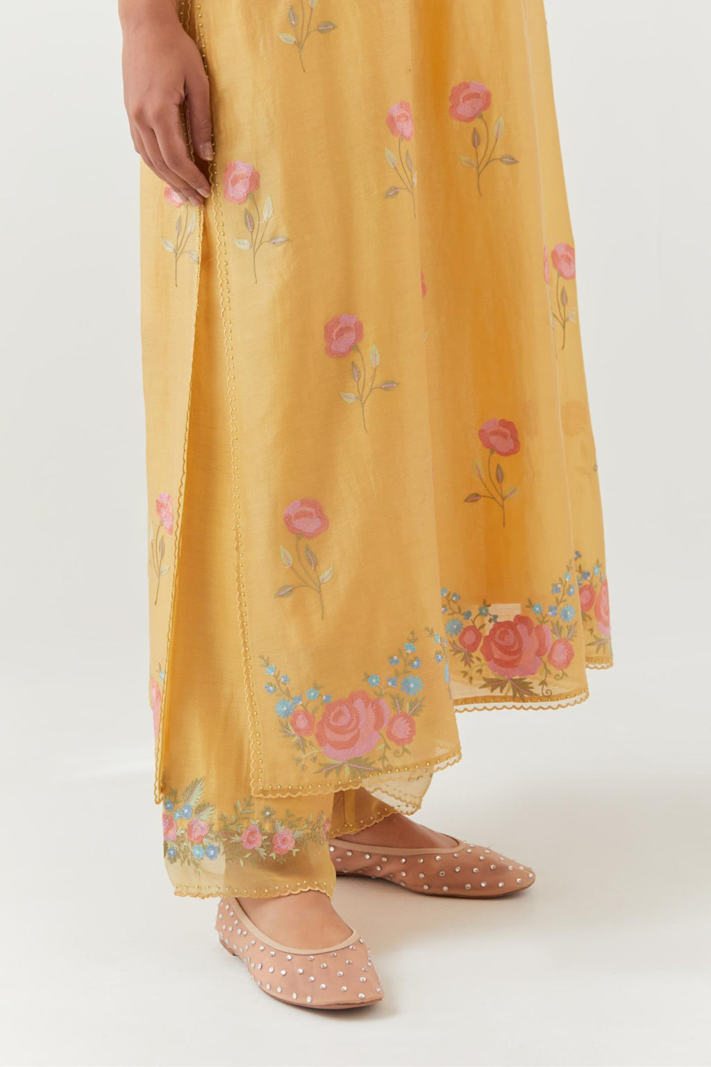 Yellow silk Chanderi straight kurta set with all-over roses embroidered in thread and scalloped organza detail at the edges.