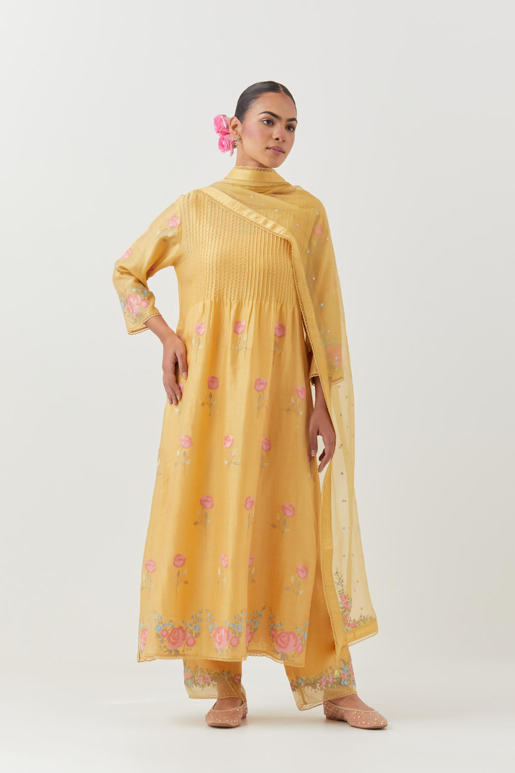 Yellow silk chanderi kurta set with pin tucks at yoke and all-over rose flower embroidery.