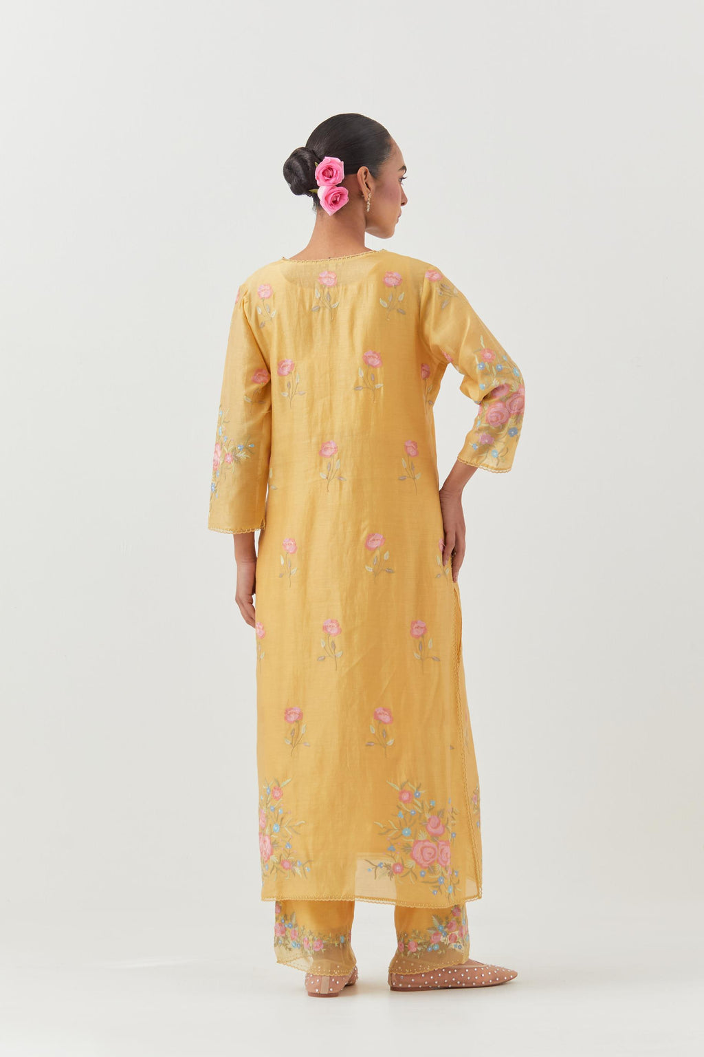 Yellow silk Chanderi straight kurta set with all-over roses embroidered in thread and scalloped organza detail at the edges.