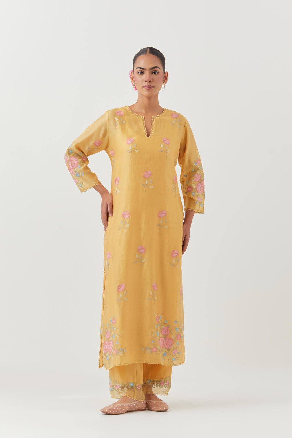 Yellow silk Chanderi straight kurta set with all-over roses embroidered in thread and scalloped organza detail at the edges.