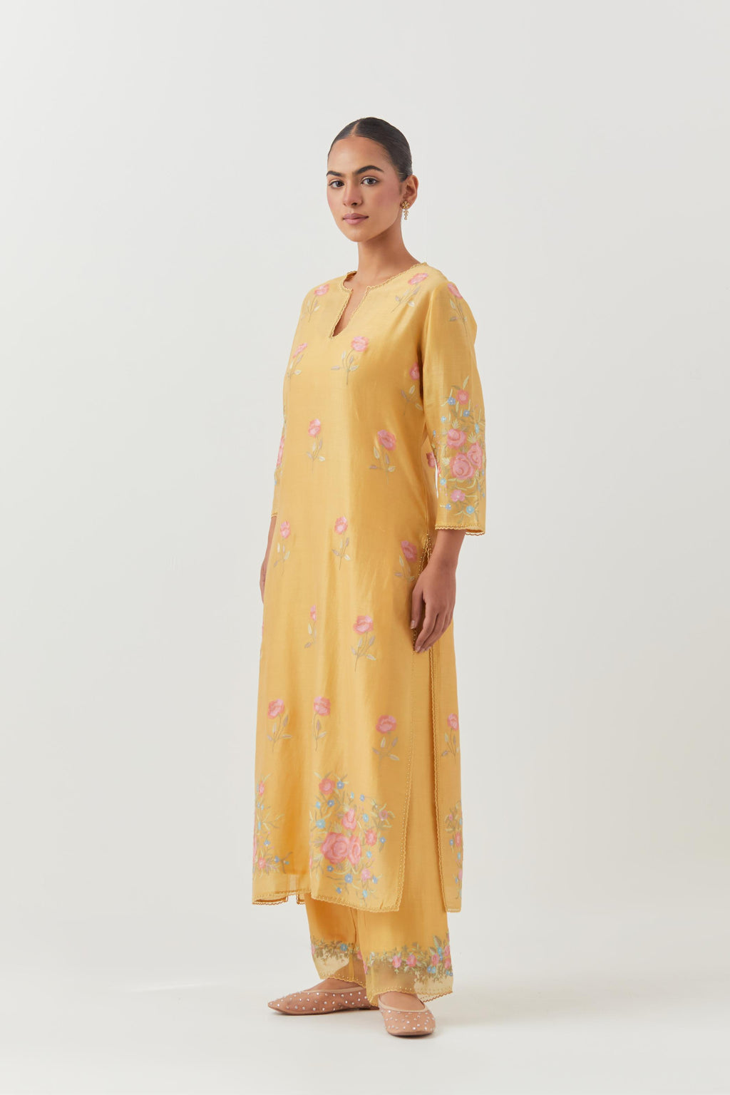 Yellow silk Chanderi straight kurta set with all-over roses embroidered in thread and scalloped organza detail at the edges.