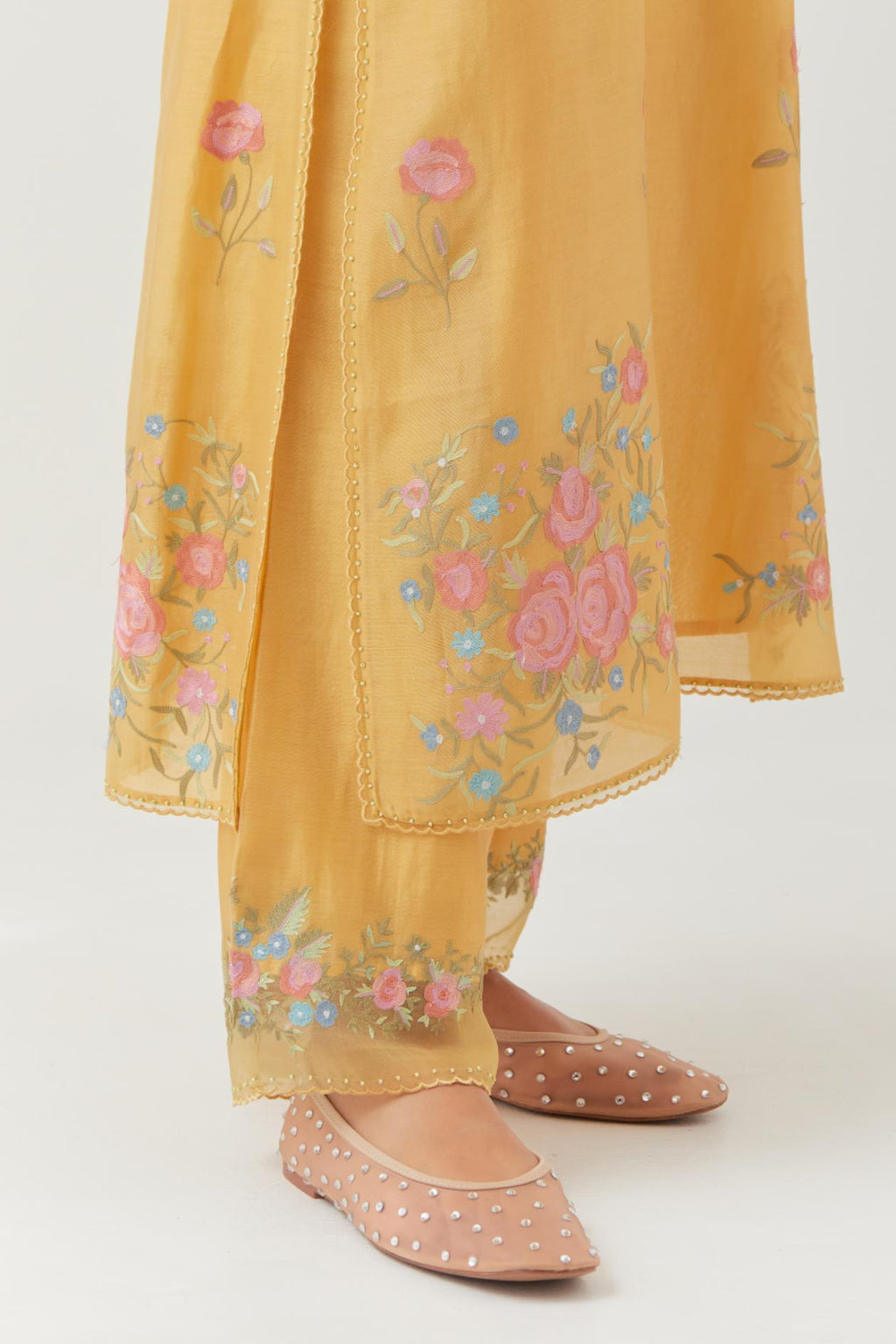 Yellow silk Chanderi straight kurta set with all-over roses embroidered in thread and scalloped organza detail at the edges.