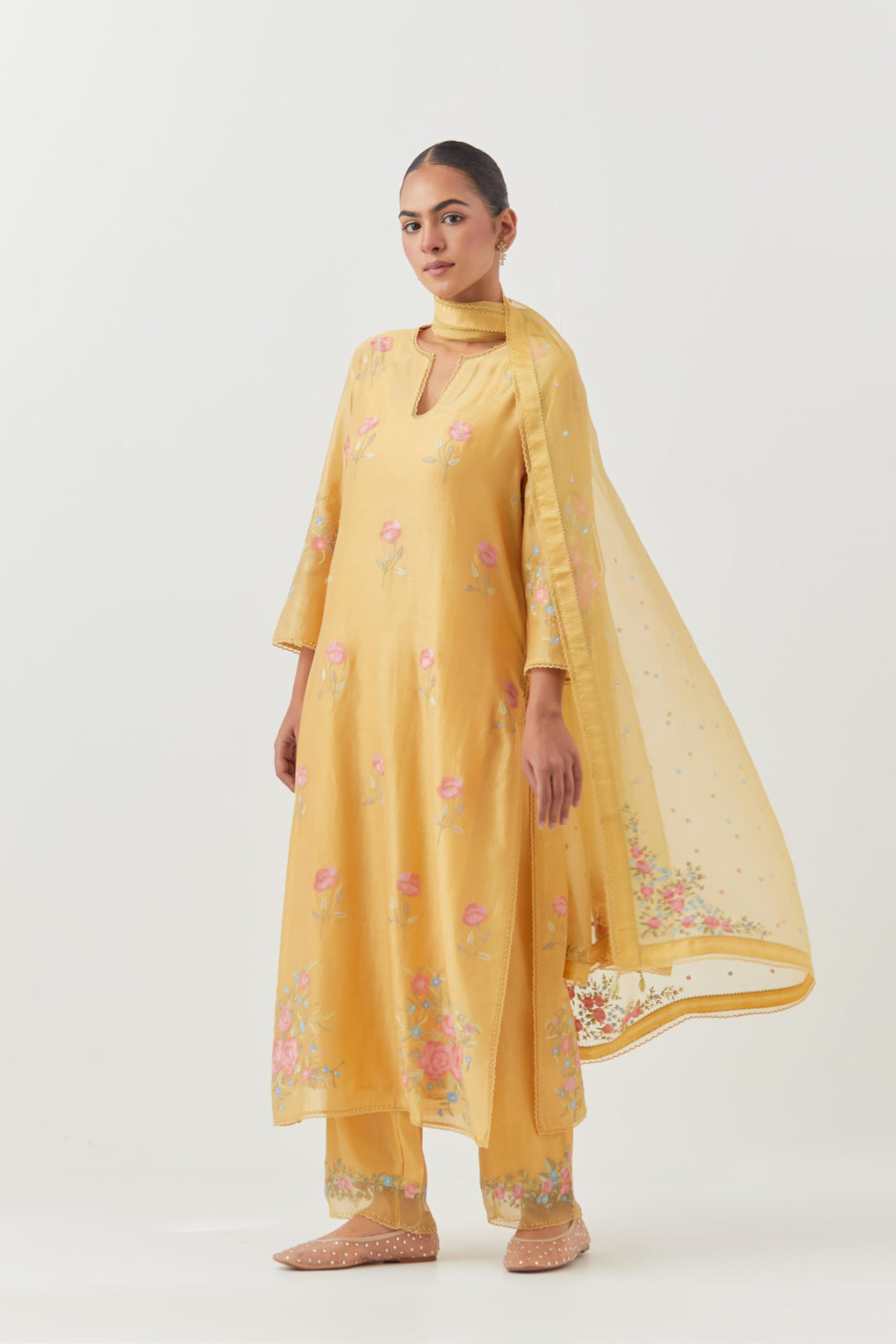 Yellow silk Chanderi straight kurta set with all-over roses embroidered in thread and scalloped organza detail at the edges.