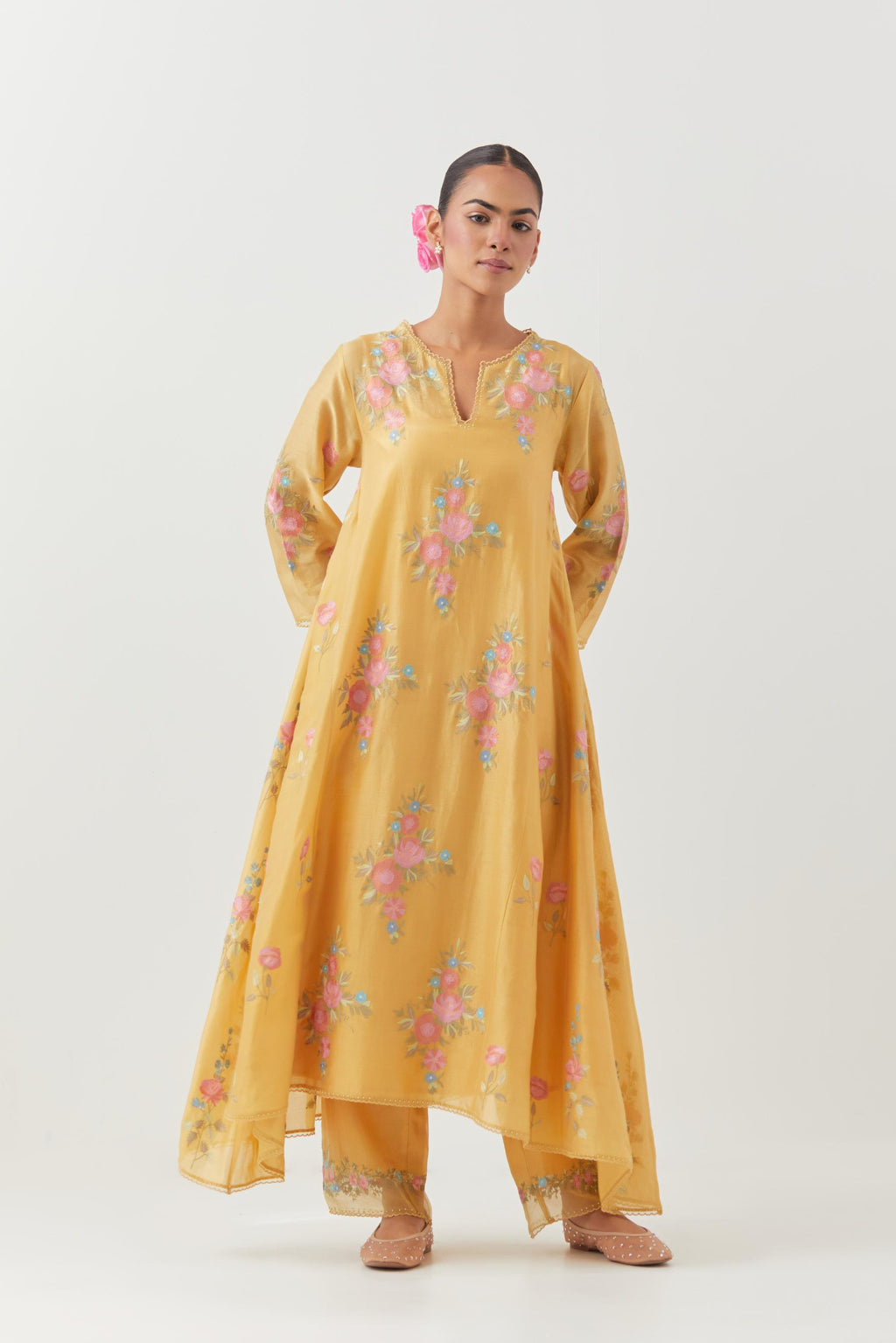 Yellow silk chanderi easy fit, asymmetric hem, paneled kurta set with all-over thread embroidered roses, highlighted with scalloped organza at the edges with contrast beads.