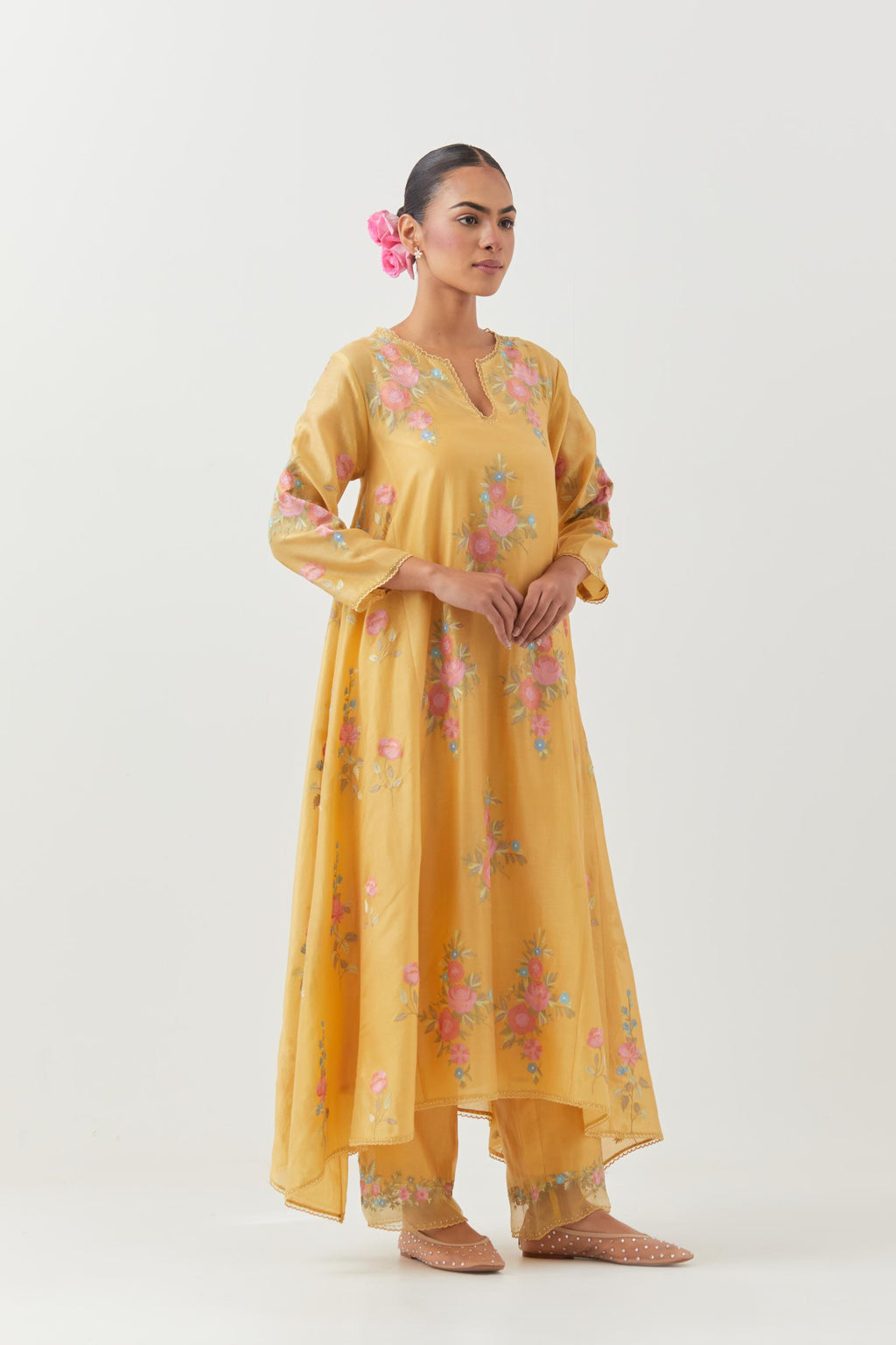 Yellow silk chanderi easy fit, asymmetric hem, paneled kurta set with all-over thread embroidered roses, highlighted with scalloped organza at the edges with contrast beads.