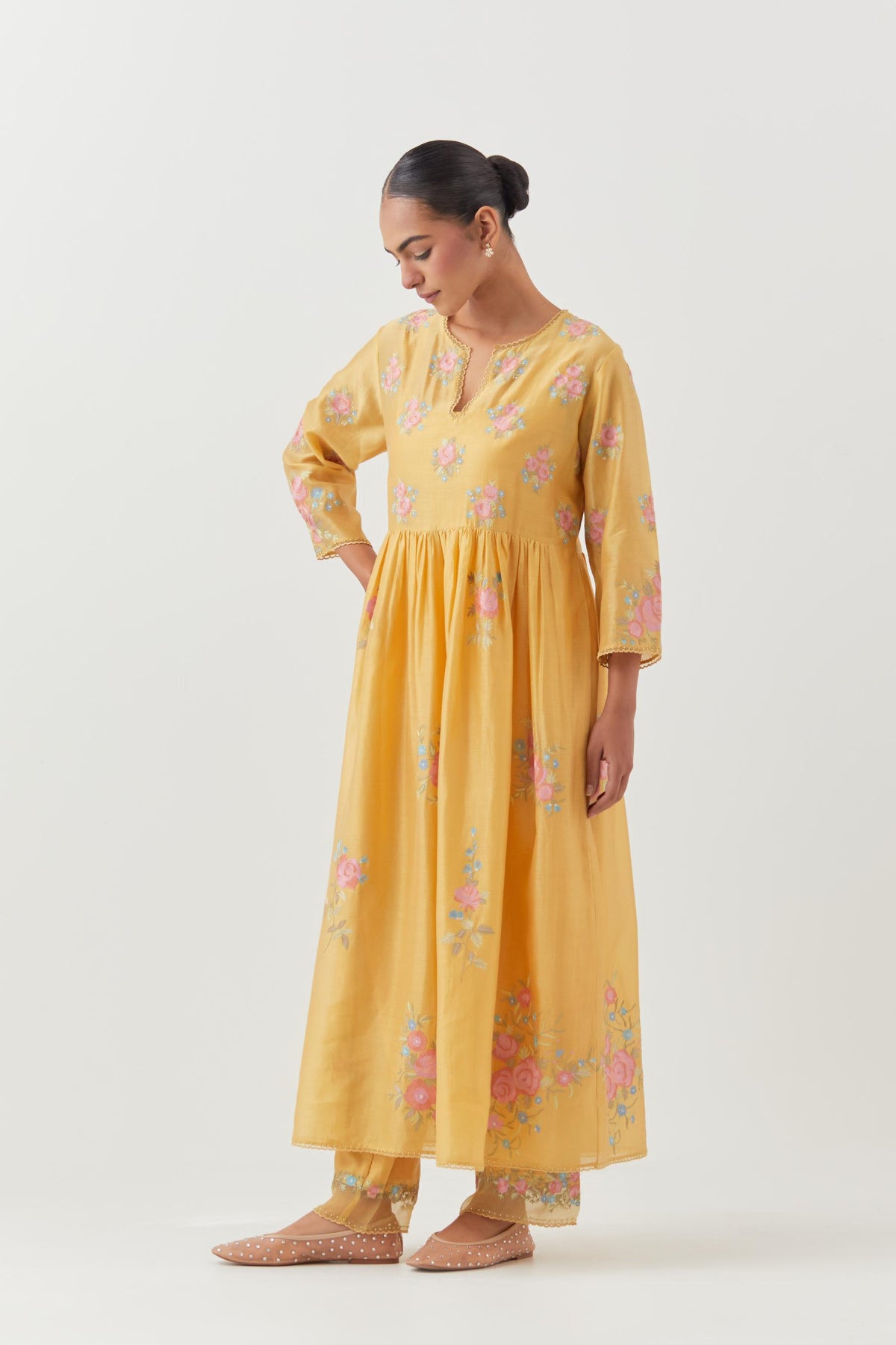 Yellow silk chanderi Kurta dress set with all-over assorted thread embroidery floral bunches.