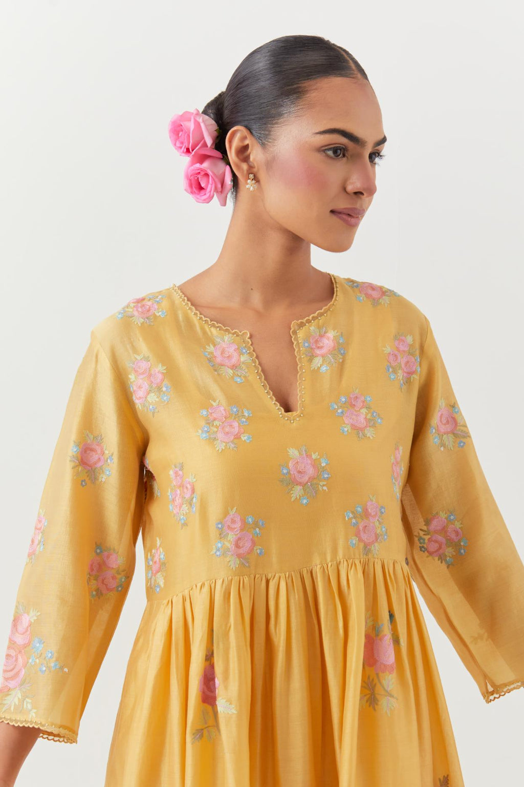 Yellow silk chanderi Kurta dress set with all-over assorted thread embroidery floral bunches.