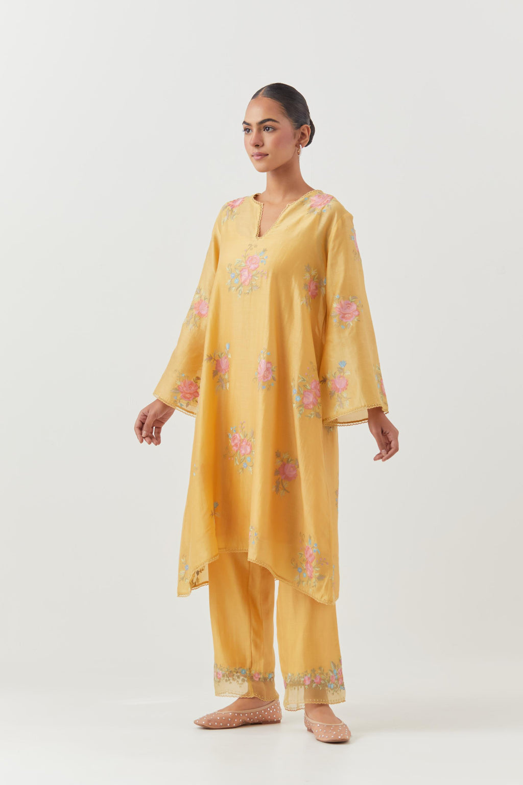 Yellow silk chanderi A-line short kurta set, with thread embroidery roses all over.