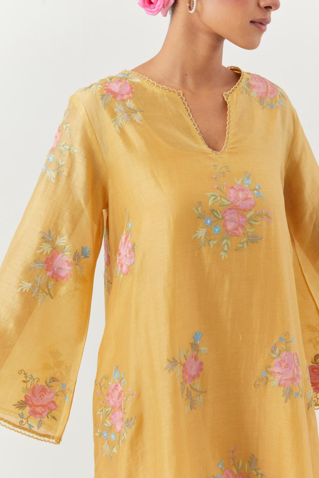 Yellow silk chanderi A-line short kurta set, with thread embroidery roses all over.