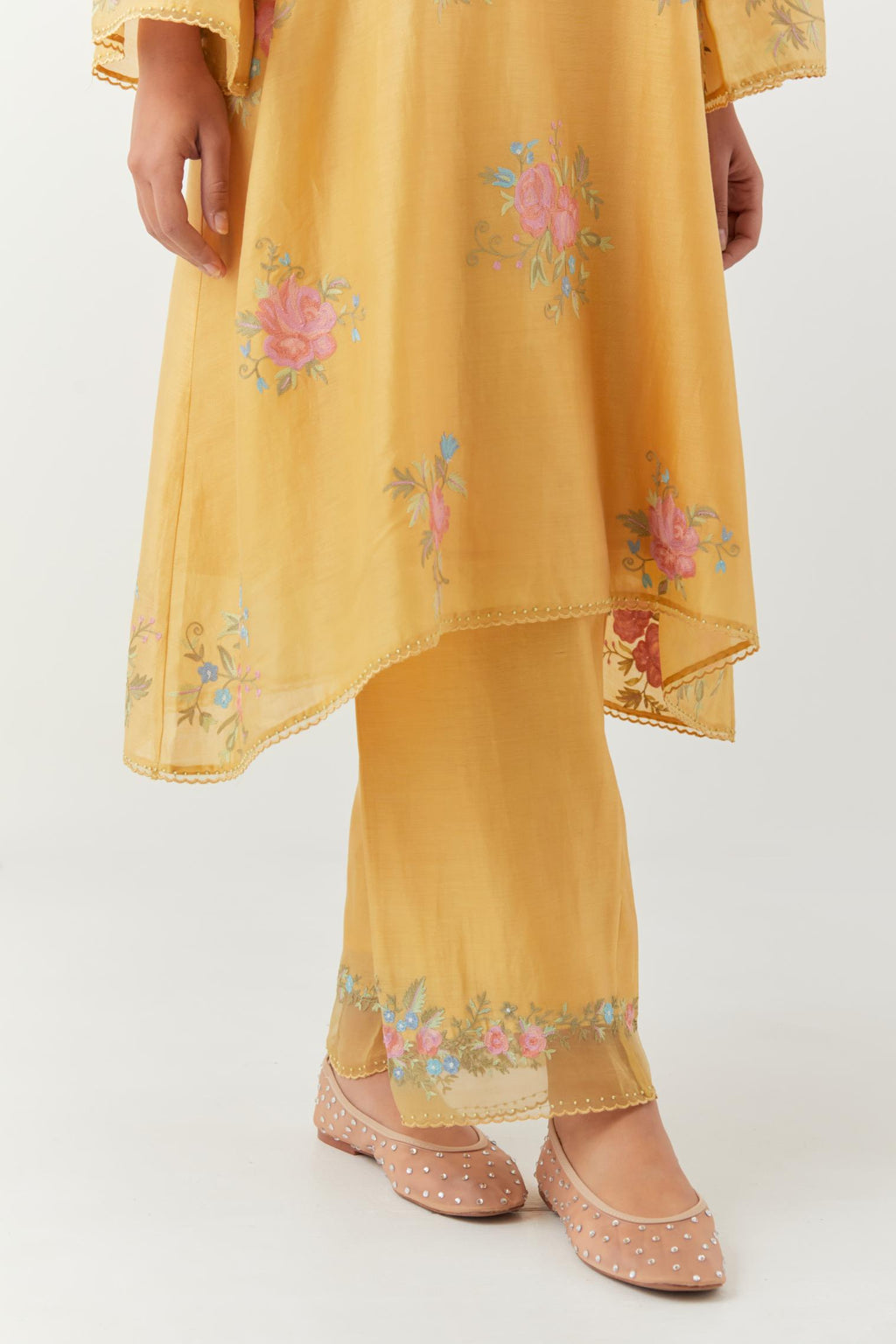 Yellow silk chanderi A-line short kurta set, with thread embroidery roses all over.