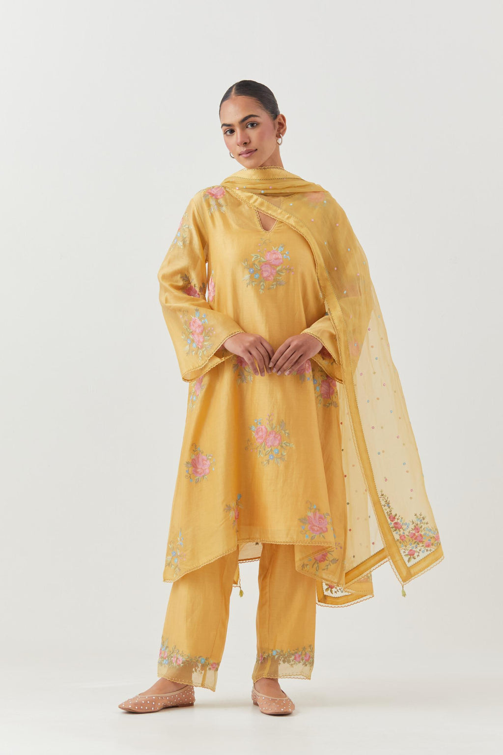 Yellow silk chanderi A-line short kurta set, with thread embroidery roses all over.