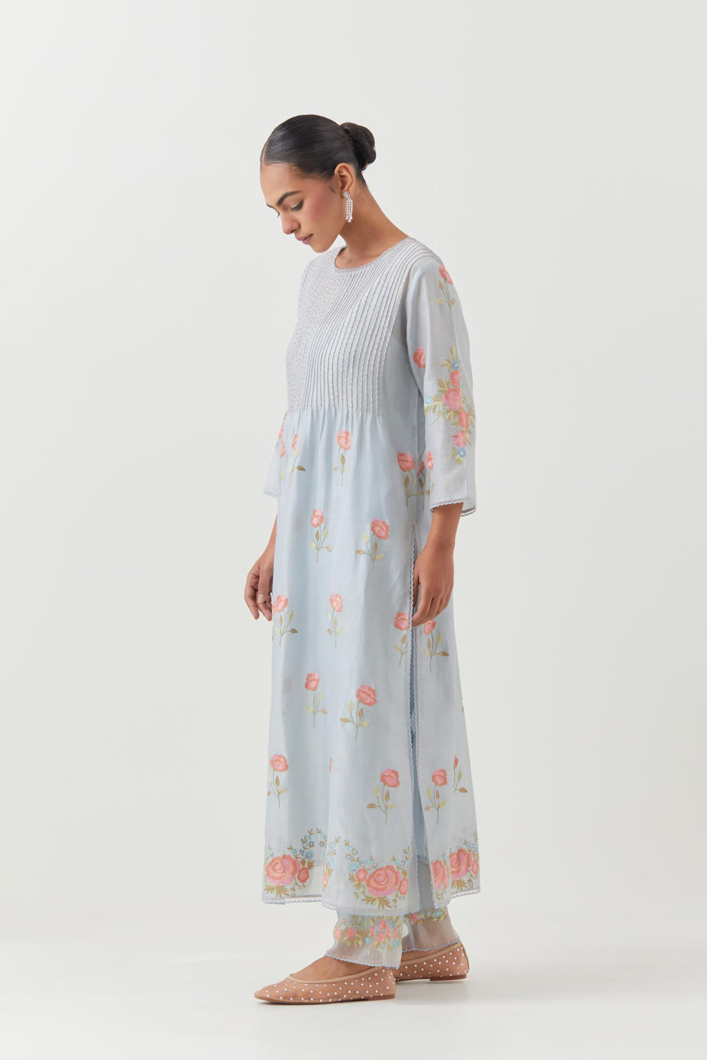 Blue silk chanderi kurta set with pin tucks at yoke and all-over rose flower embroidery.