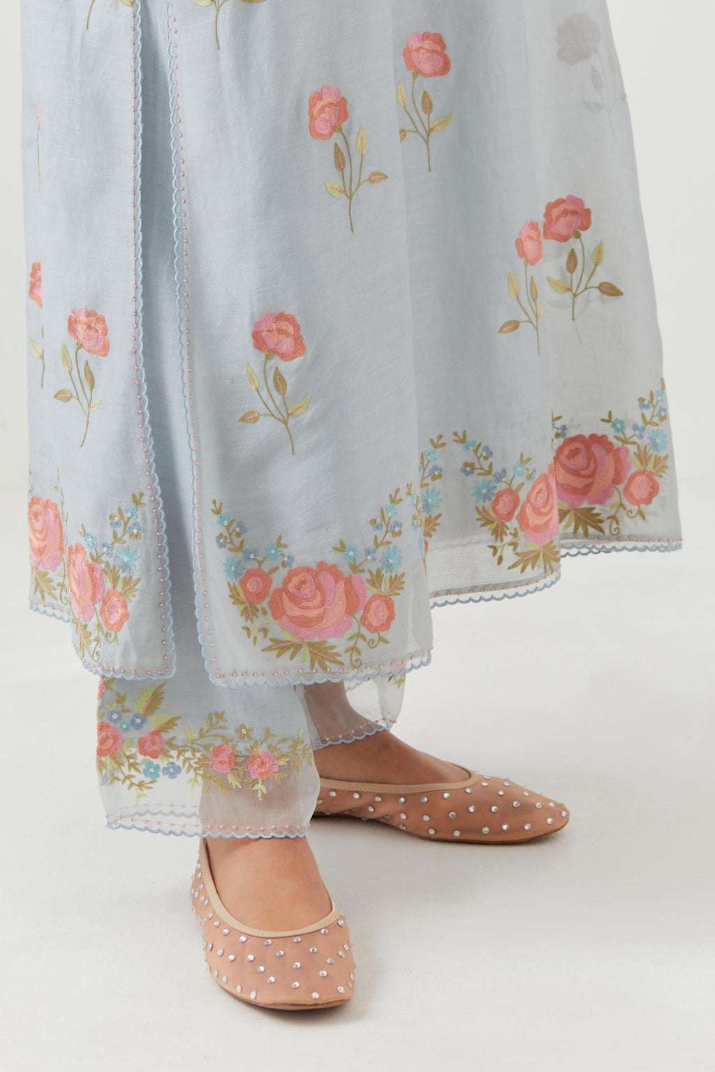 Blue silk Chanderi straight kurta set with all-over roses embroidered in thread and scalloped organza detail at the edges.