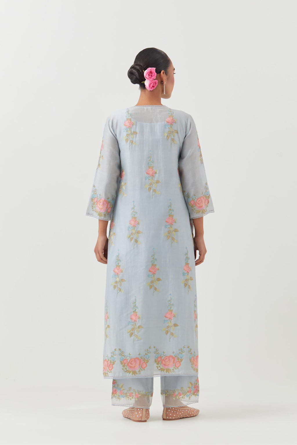 Blue silk Chanderi straight kurta set with all-over rose embroidery and scalloped organza detail at the edges.