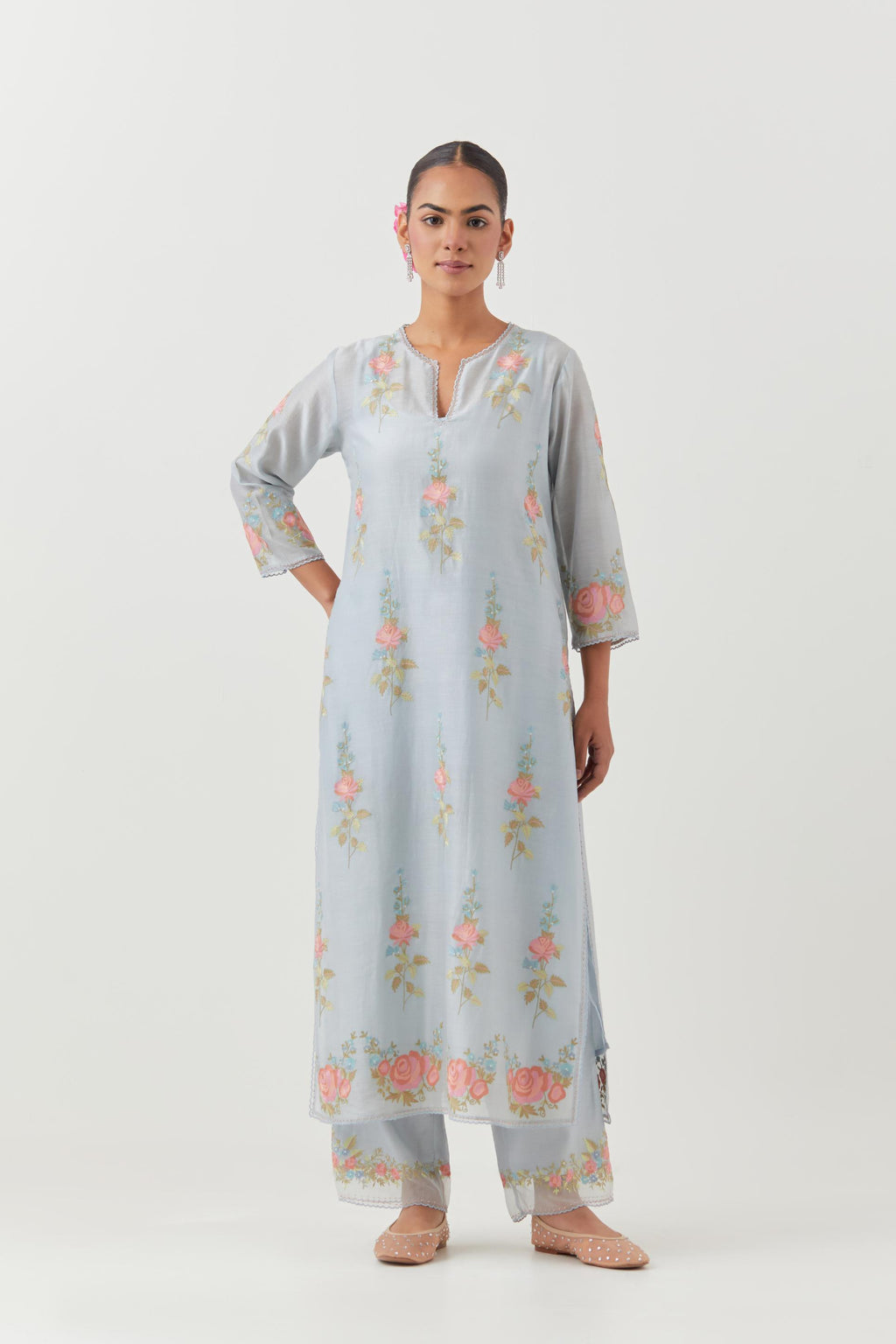 Blue silk Chanderi straight kurta set with all-over rose embroidery and scalloped organza detail at the edges.