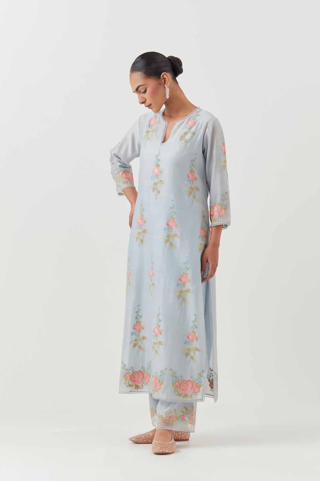 Blue silk Chanderi straight kurta set with all-over rose embroidery and scalloped organza detail at the edges.