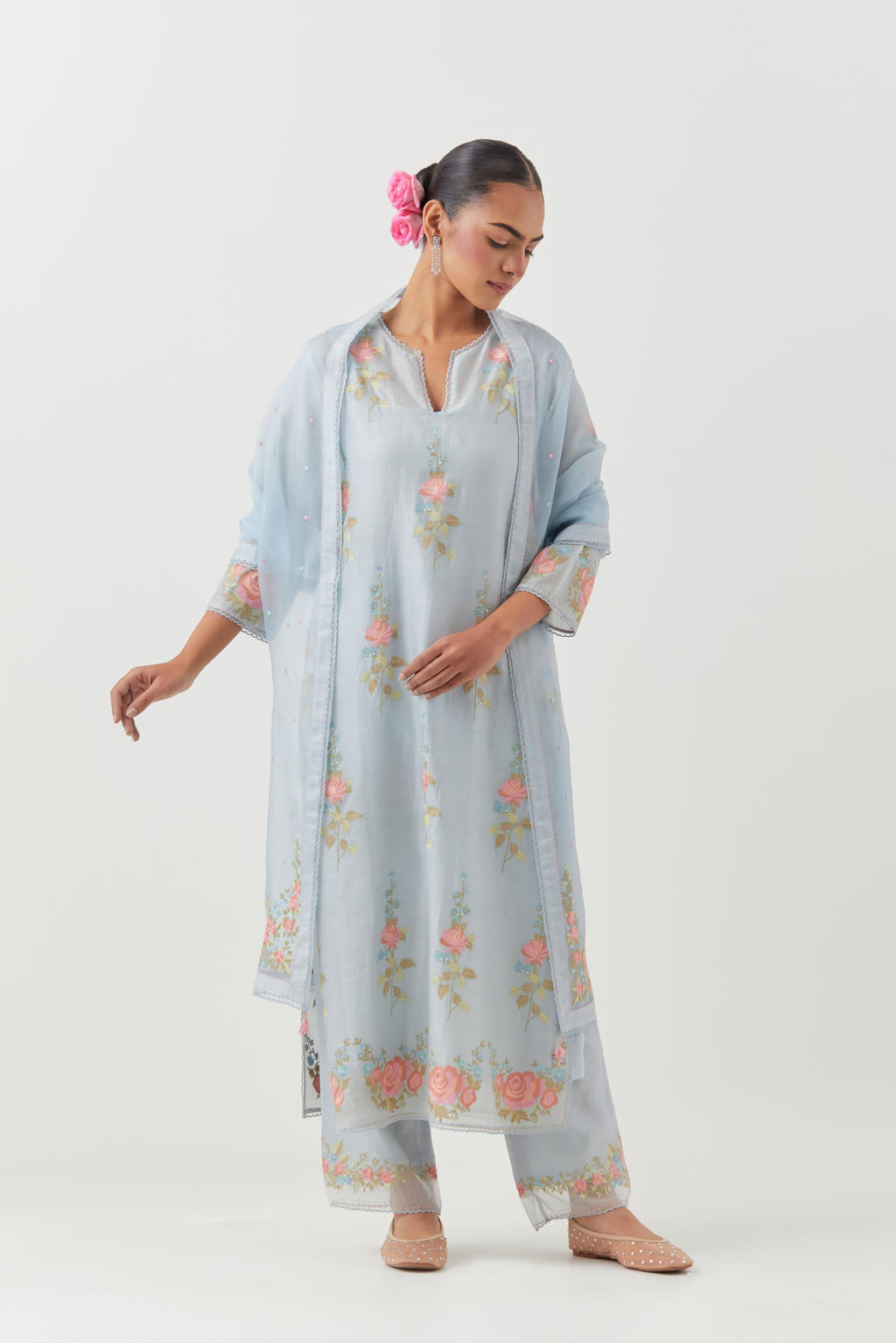 Blue silk Chanderi straight kurta set with all-over rose embroidery and scalloped organza detail at the edges.