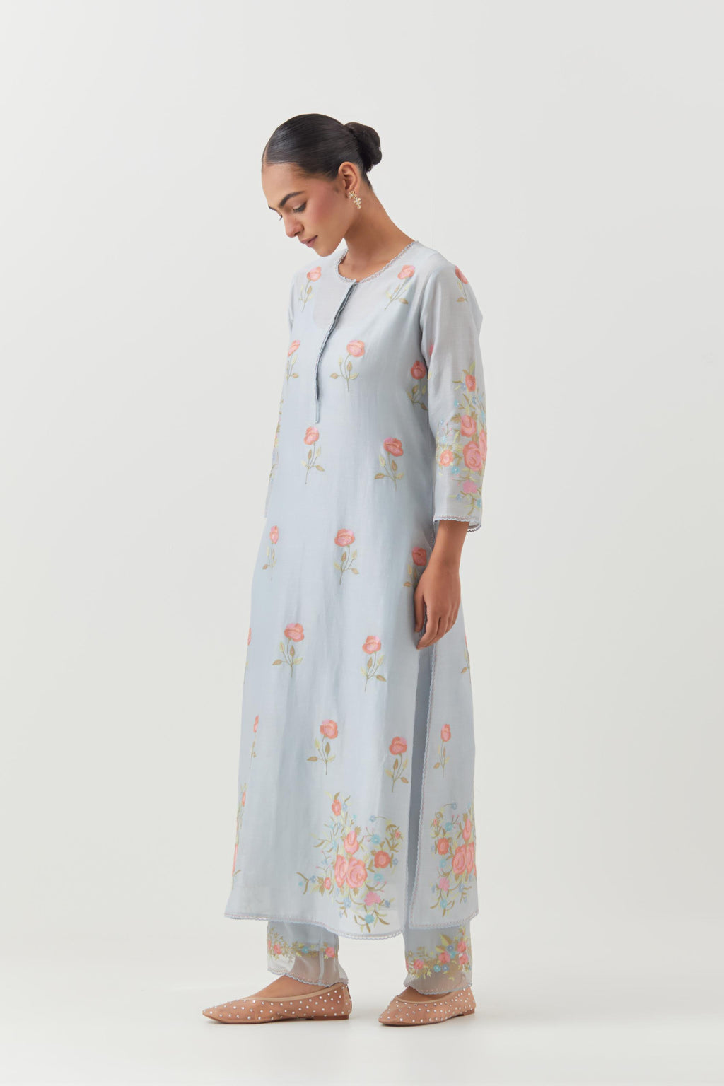 Blue silk Chanderi straight kurta set with all-over roses embroidered in thread and scalloped organza detail at the edges.