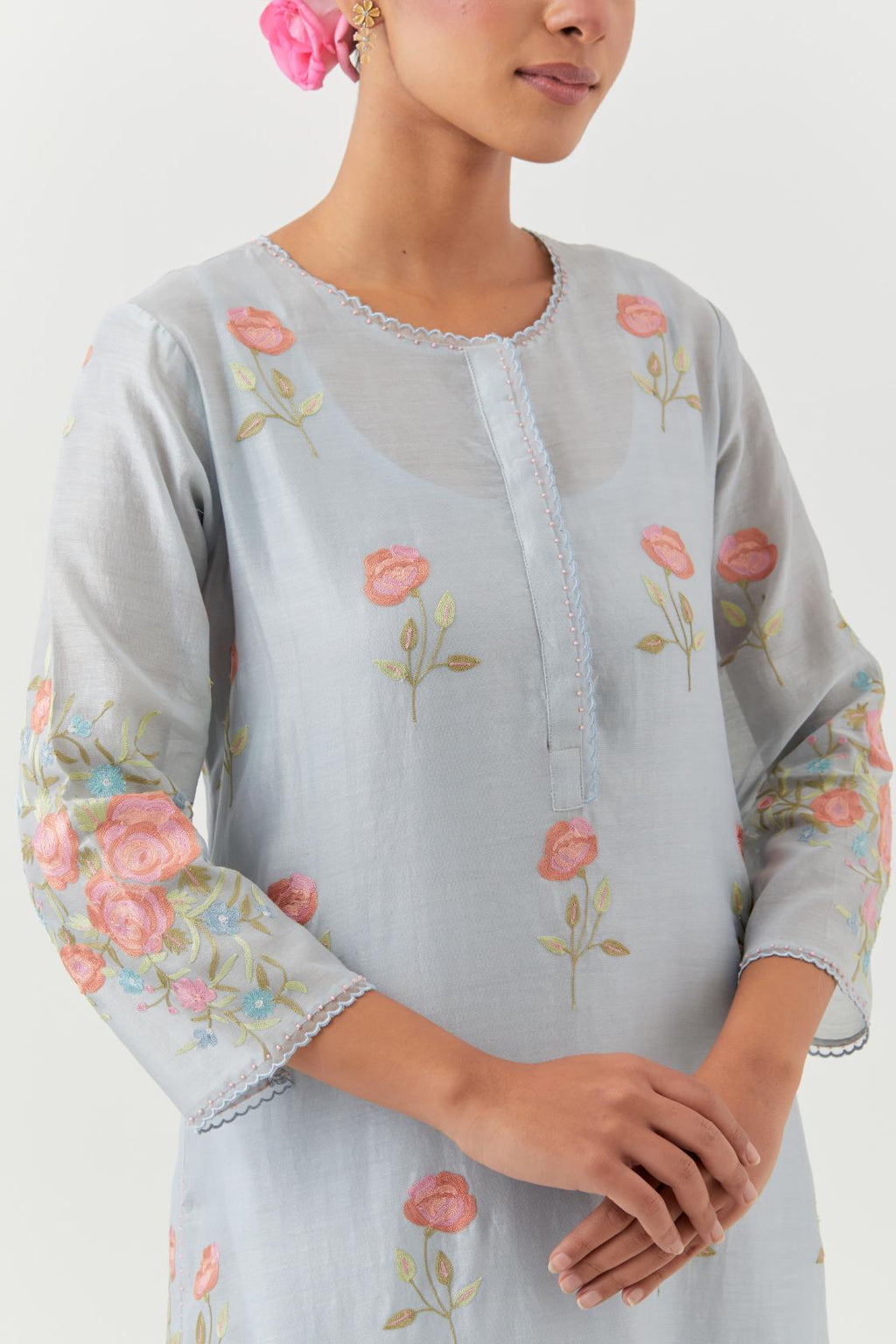 Blue silk Chanderi straight kurta set with all-over roses embroidered in thread and scalloped organza detail at the edges.