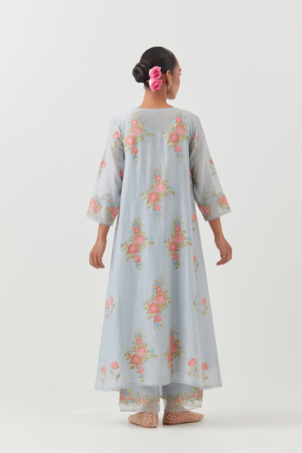 Blue silk chanderi easy fit, asymmetric hem, paneled kurta set with all-over thread embroidered roses, highlighted with scalloped organza at the edges with contrast beads.