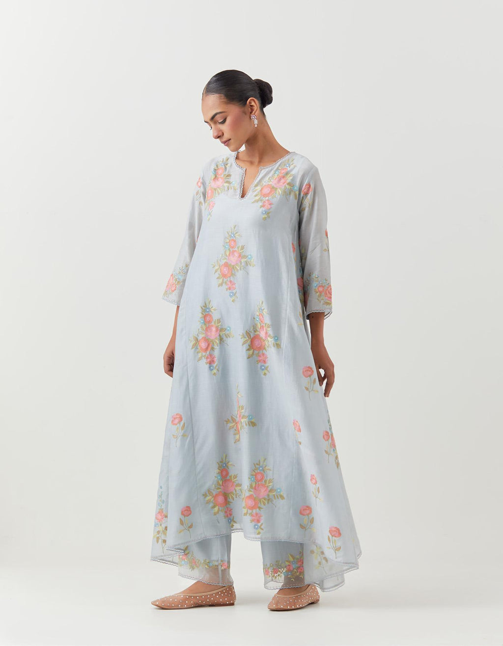 Blue silk chanderi easy fit, asymmetric hem, paneled kurta set with all-over thread embroidered roses, highlighted with scalloped organza at the edges with contrast beads.