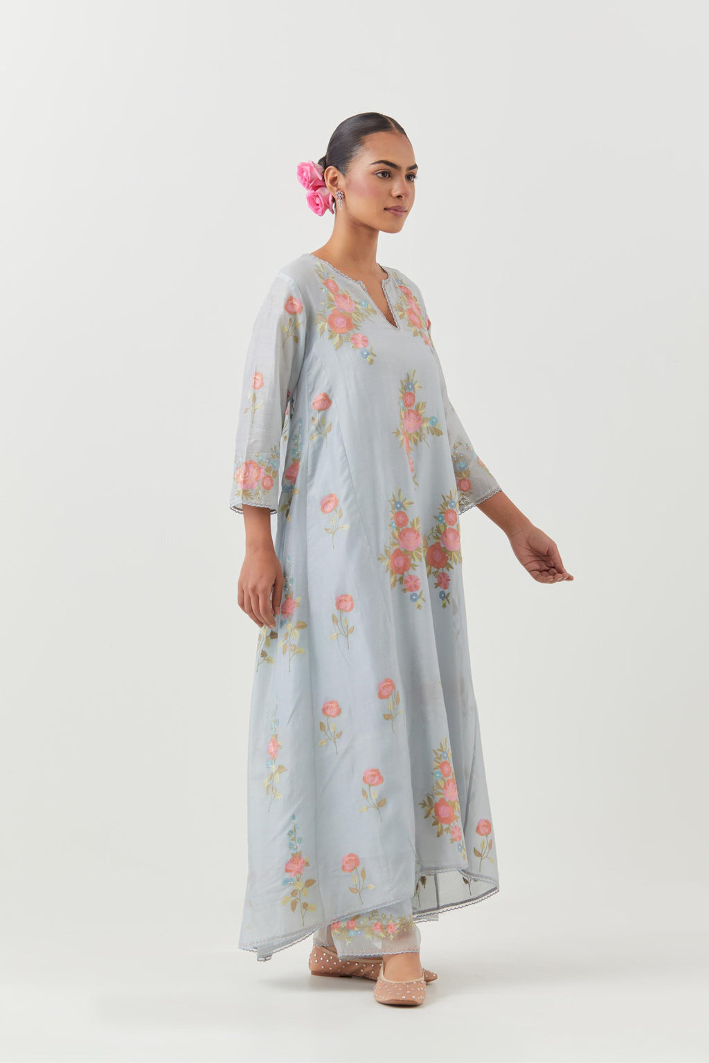 Blue silk chanderi easy fit, asymmetric hem, paneled kurta set with all-over thread embroidered roses, highlighted with scalloped organza at the edges with contrast beads.