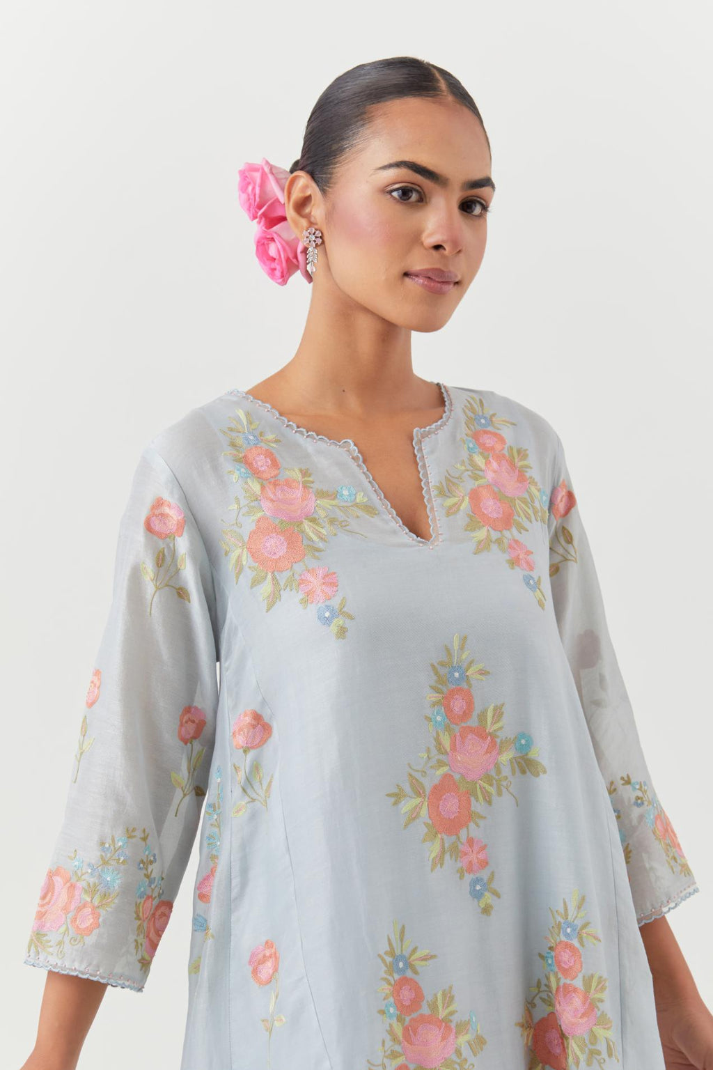 Blue silk chanderi easy fit, asymmetric hem, paneled kurta set with all-over thread embroidered roses, highlighted with scalloped organza at the edges with contrast beads.