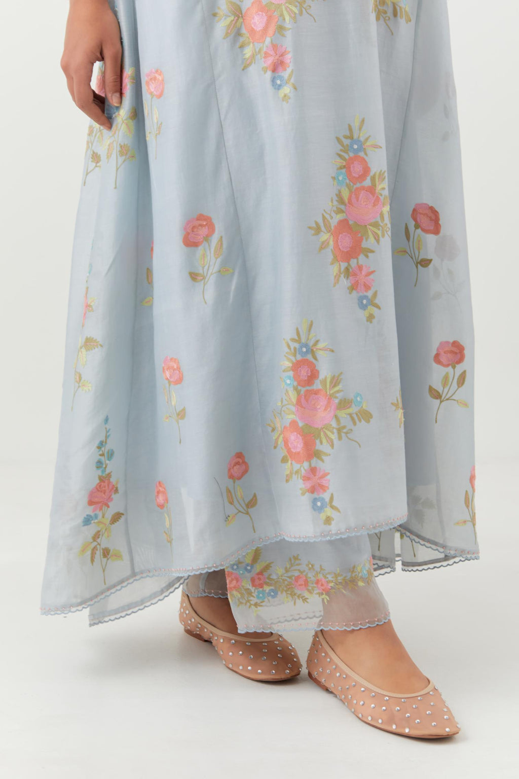 Blue silk chanderi easy fit, asymmetric hem, paneled kurta set with all-over thread embroidered roses, highlighted with scalloped organza at the edges with contrast beads.