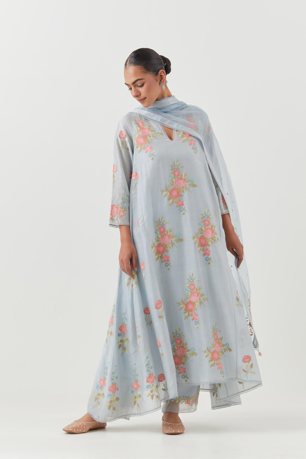 Blue silk chanderi easy fit, asymmetric hem, paneled kurta set with all-over thread embroidered roses, highlighted with scalloped organza at the edges with contrast beads.