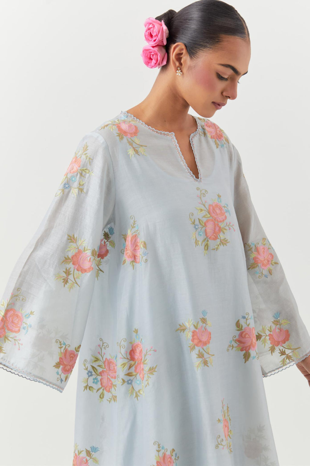 Blue silk chanderi A-line short kurta set, with thread embroidery roses all over.