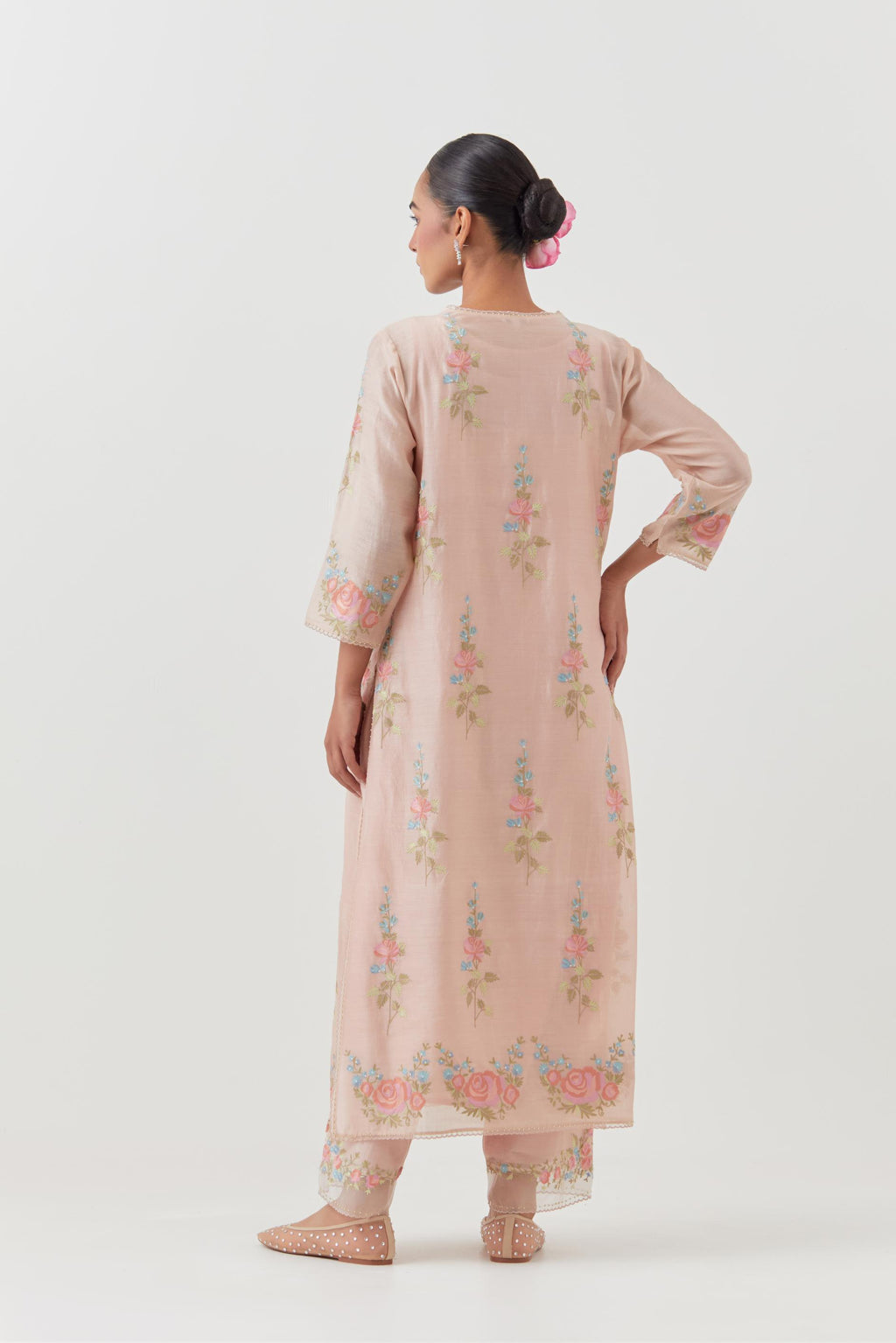 Pink silk Chanderi straight kurta set with all-over rose embroidery and scalloped organza detail at the edges.